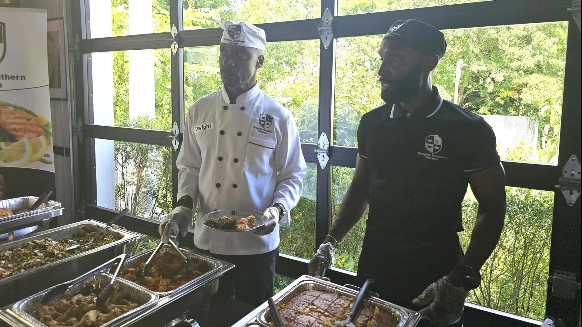 Catering team member serving a buffet at an event